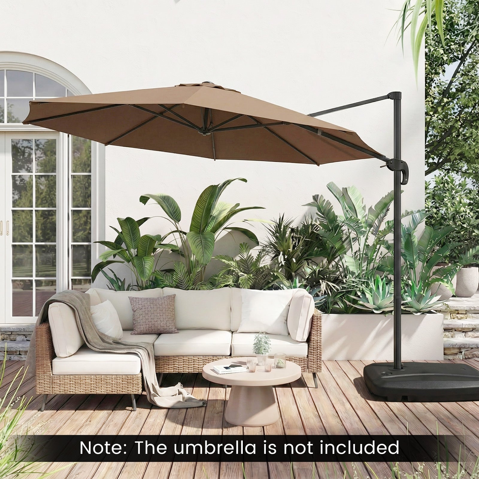 Outdoor patio set with a brown cantilever umbrella on a wooden deck, surrounded by plants.