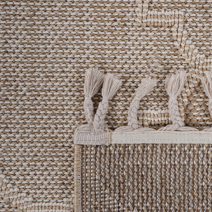 Close-up of a textured beige rug with tassels