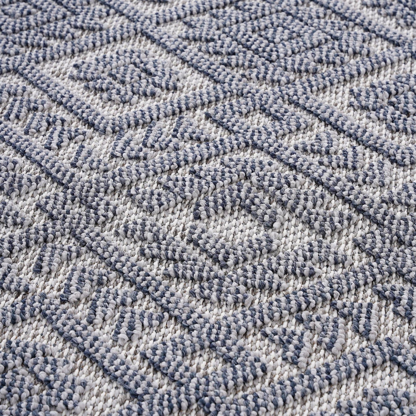Close-up of a textured blue and gray carpet