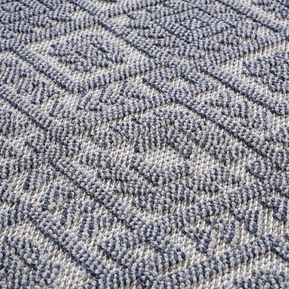 Close-up of a textured blue and gray carpet