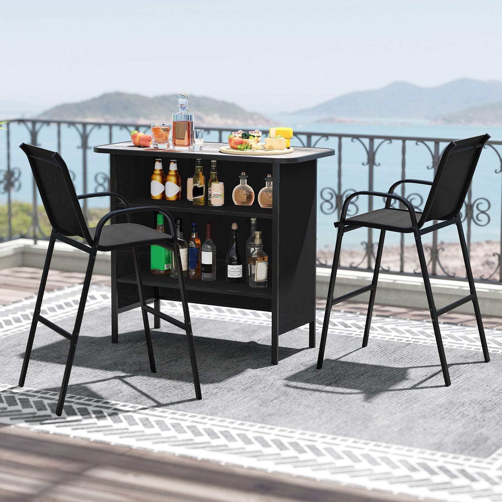 Outdoor bar set with bottles and snacks on a balcony with a mountain view