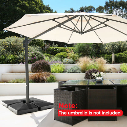 Beige patio umbrella with stand on a patio with garden view