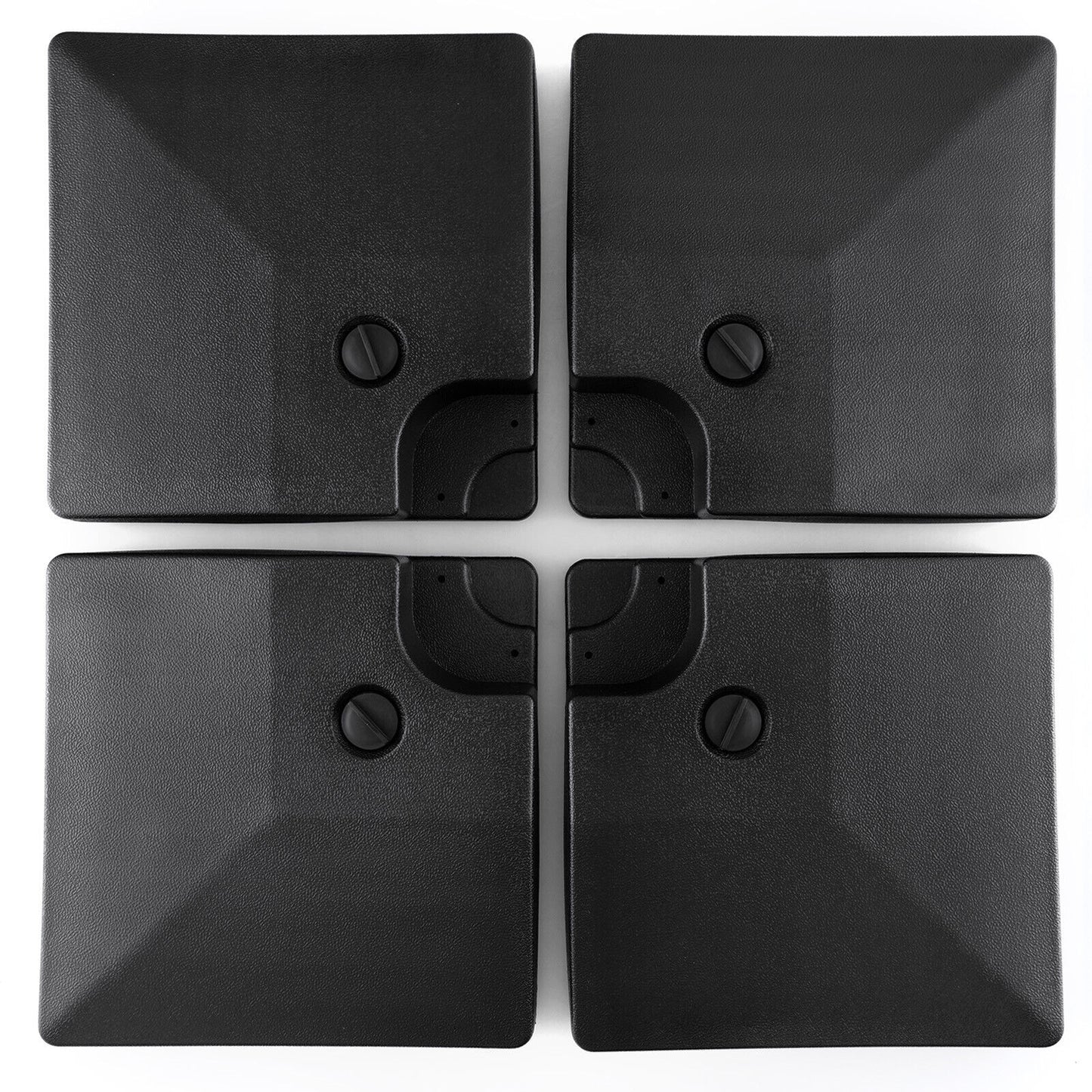 Four black square objects with embedded screws on a white background