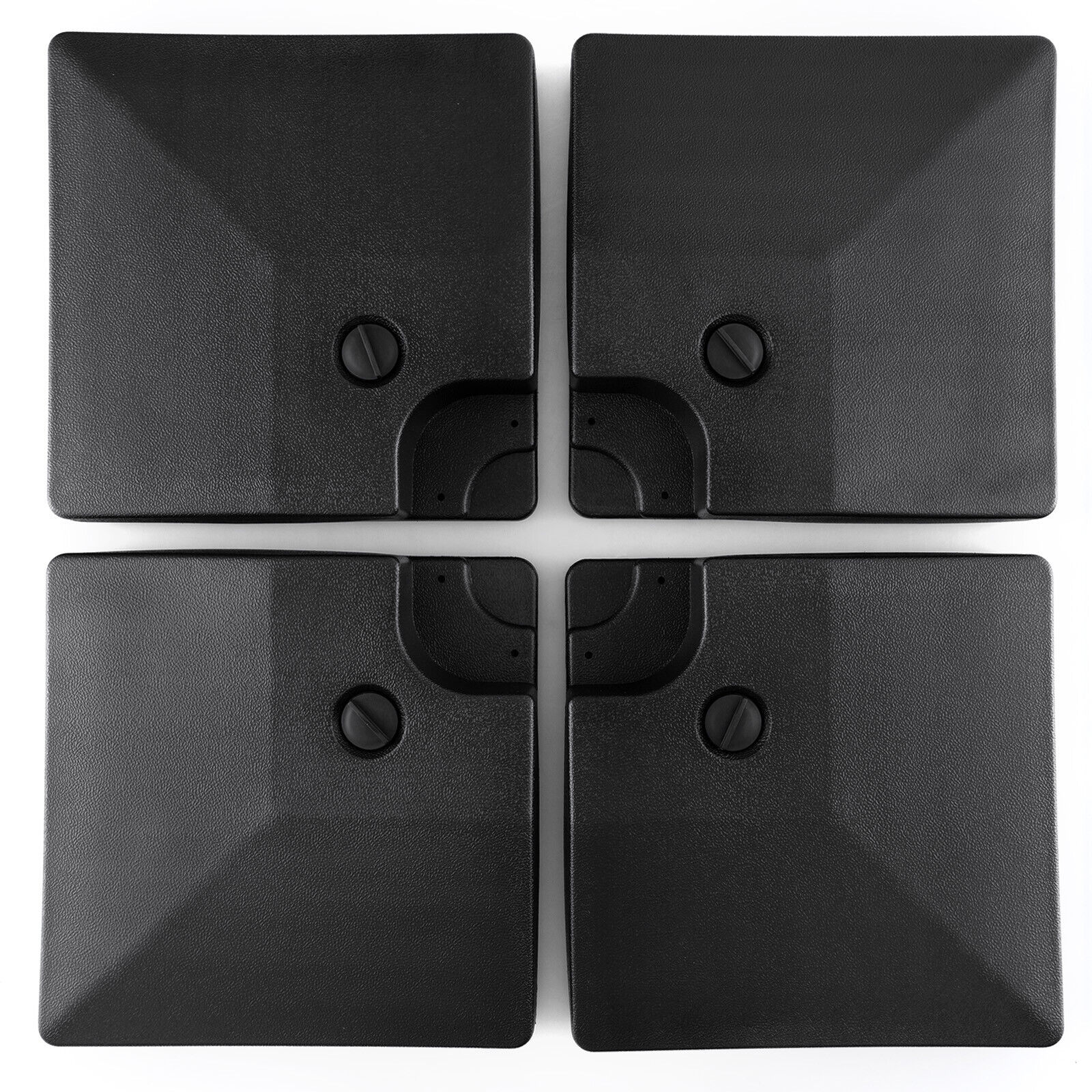 Four black square objects with embedded screws on a white background