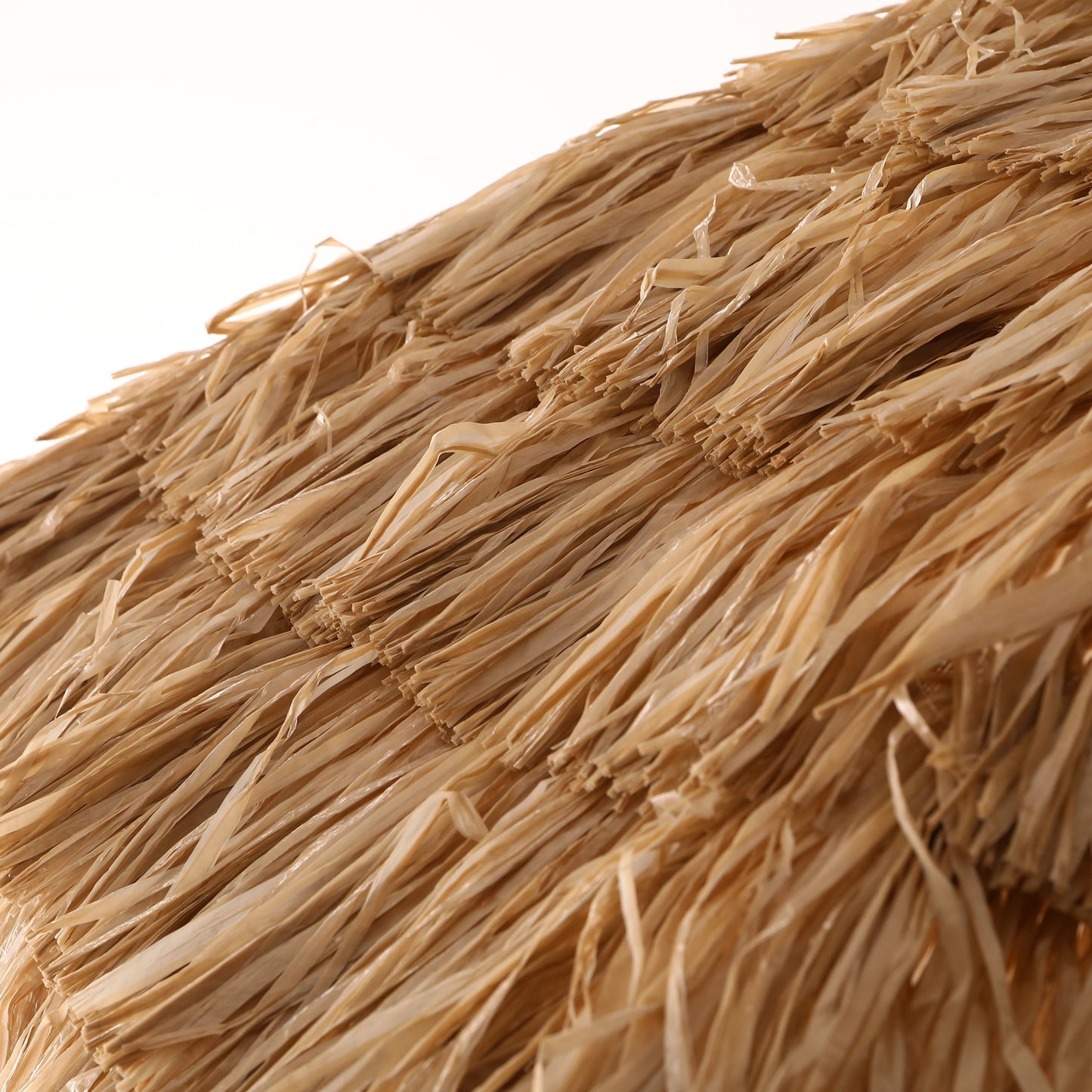 Close-up of straw material with a white background