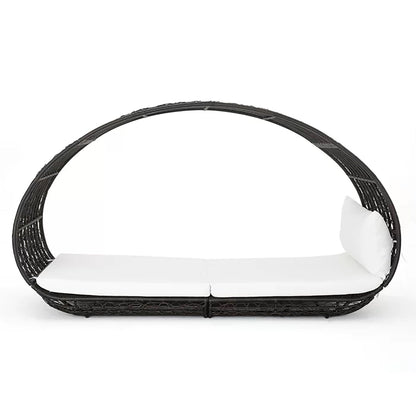 Black wicker chair with white cushion on a white background