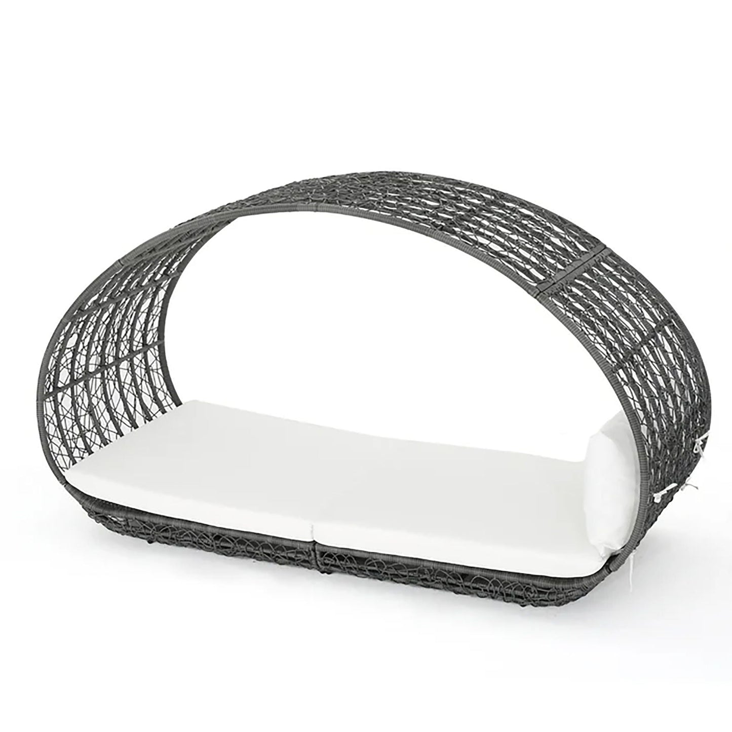 Black wicker pet bed with a white cushion on a white background