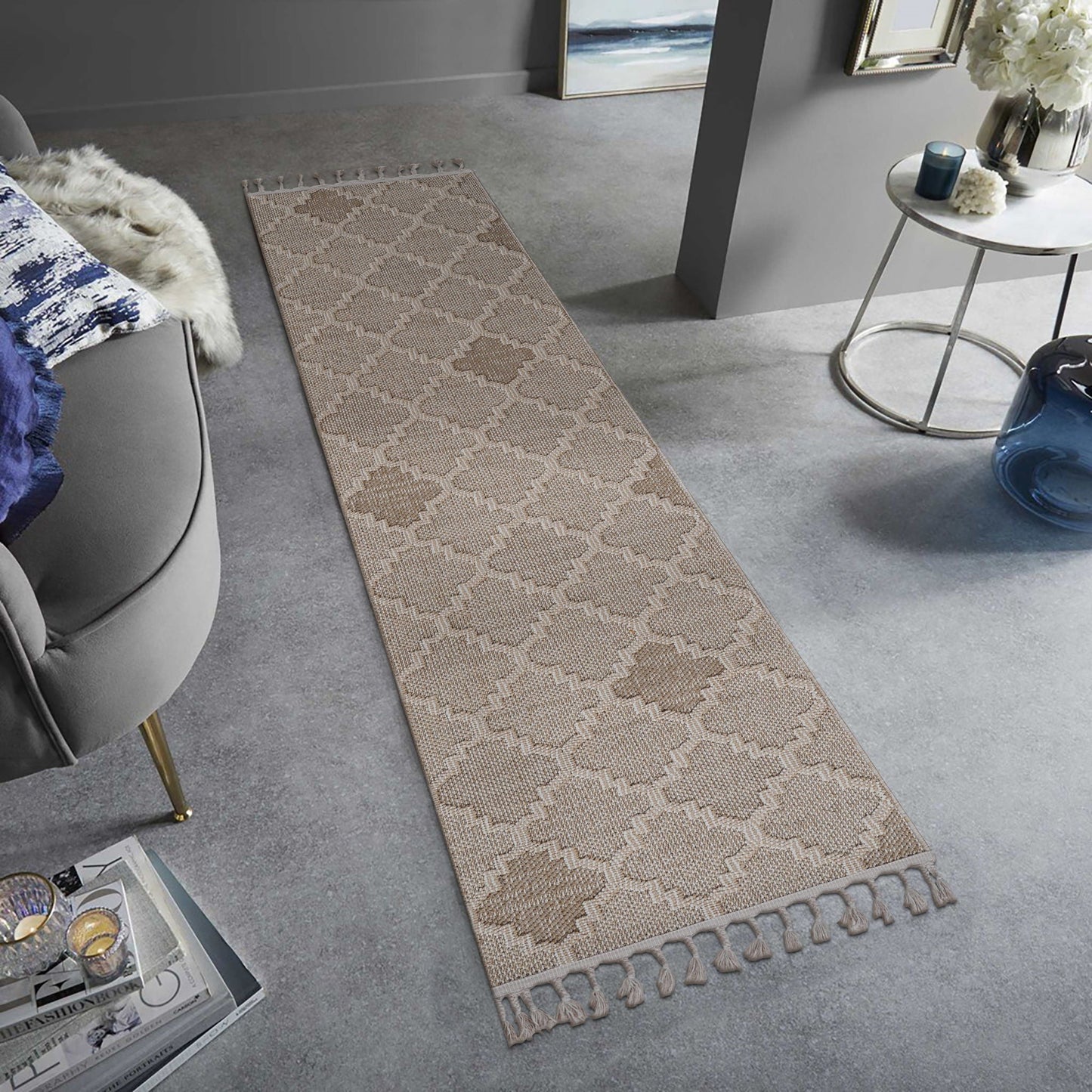 Long rectangular rug with a geometric pattern on a gray floor in a living room setting.