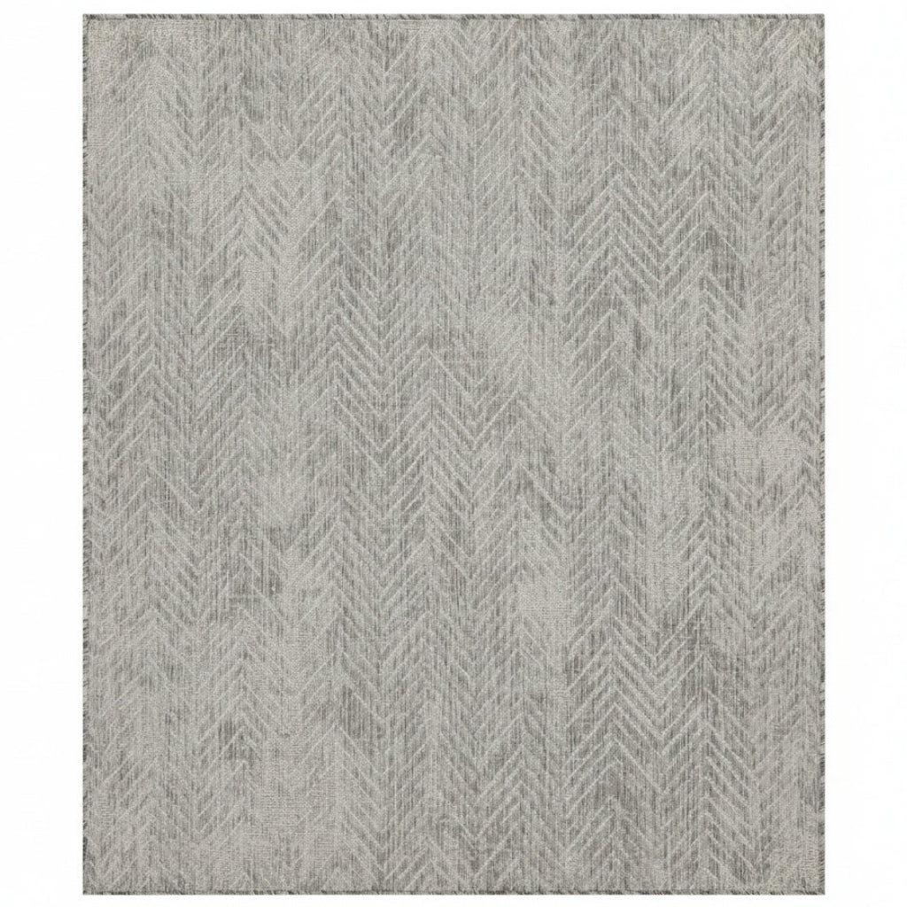 Gray area rug with a geometric pattern on a white background