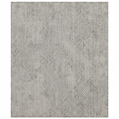 Gray area rug with a geometric pattern on a white background