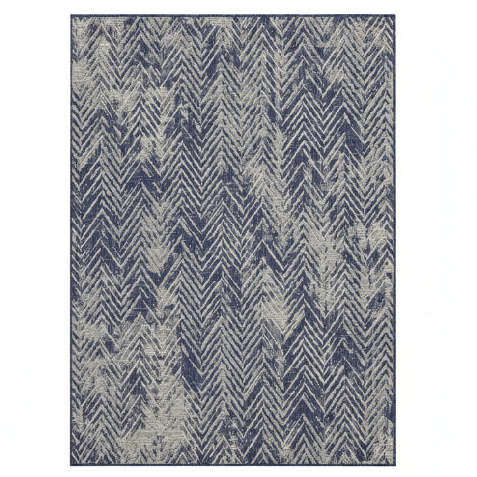 Rug with blue and beige chevron pattern