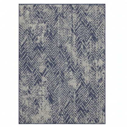 Rug with blue and beige chevron pattern