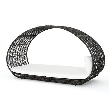 Black wicker daybed with white cushion on a white background