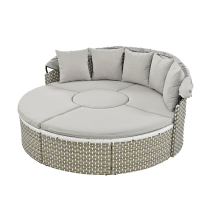 Round outdoor sofa with gray cushions on a white background