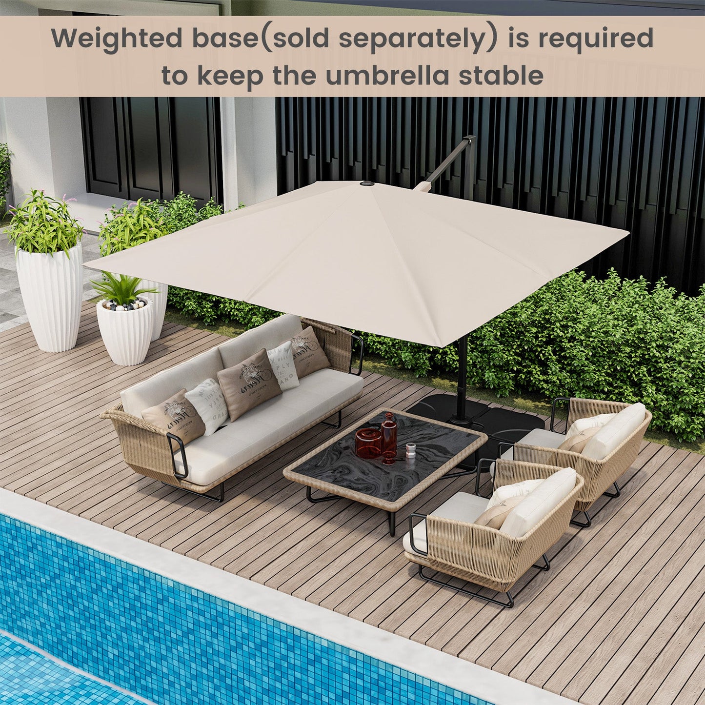 Outdoor patio set with beige umbrella on a wooden deck by a pool.