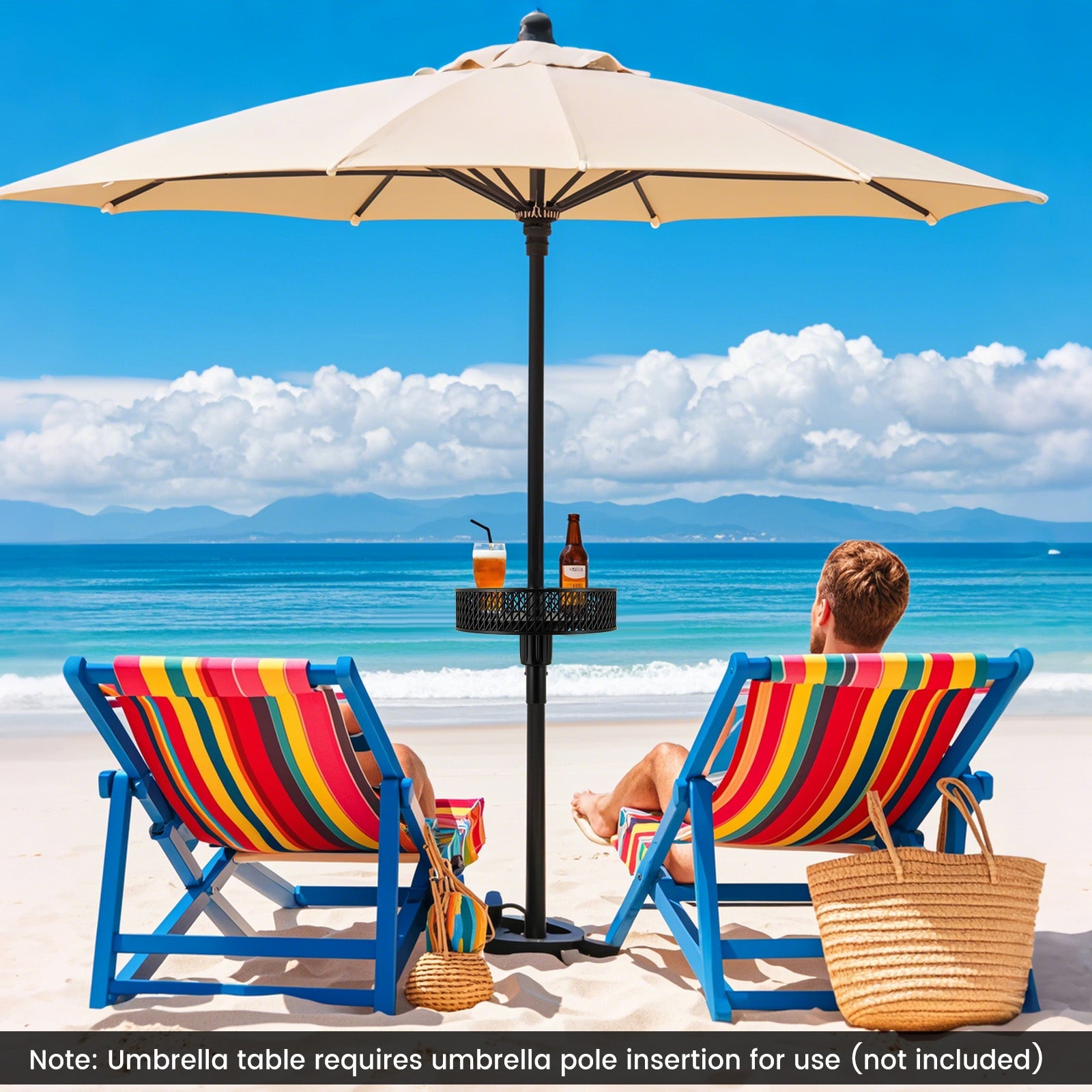 Two people sitting on colorful beach chairs under a large beige umbrella with a view of the ocean.
