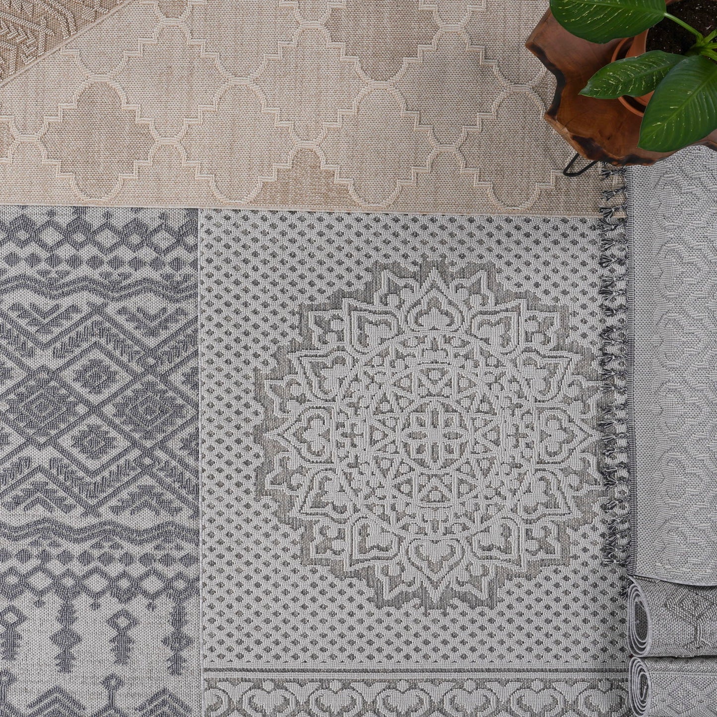 Patterned rugs with geometric and medallion designs on a neutral background.