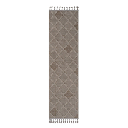 Patterned rug with tassels on a white background