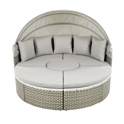 Round outdoor daybed with cushions on a white background