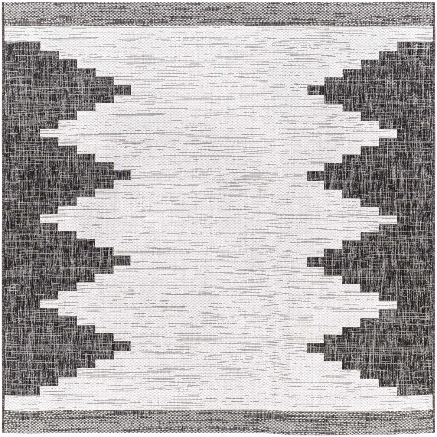 Black and white geometric patterned rug
