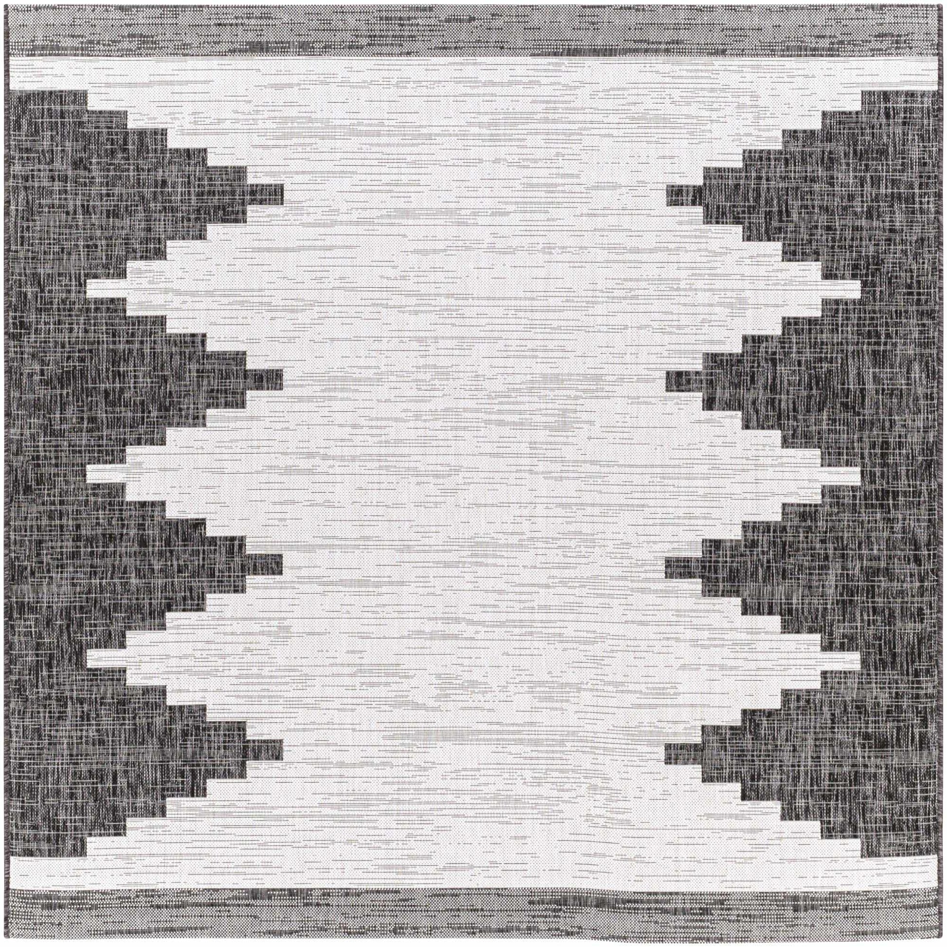 Black and white geometric patterned rug