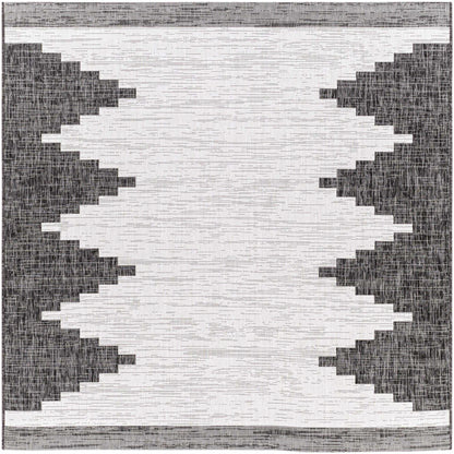 Black and white geometric patterned rug