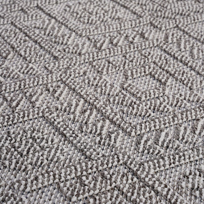 Close-up of textured gray carpet with a diamond pattern