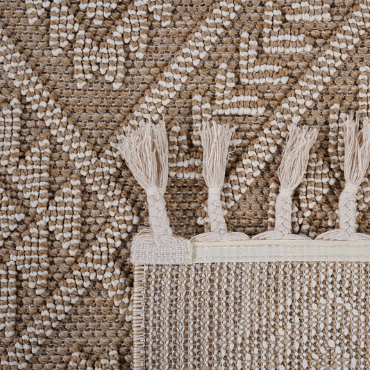 Close-up of a textured rug with tassels on a matching background