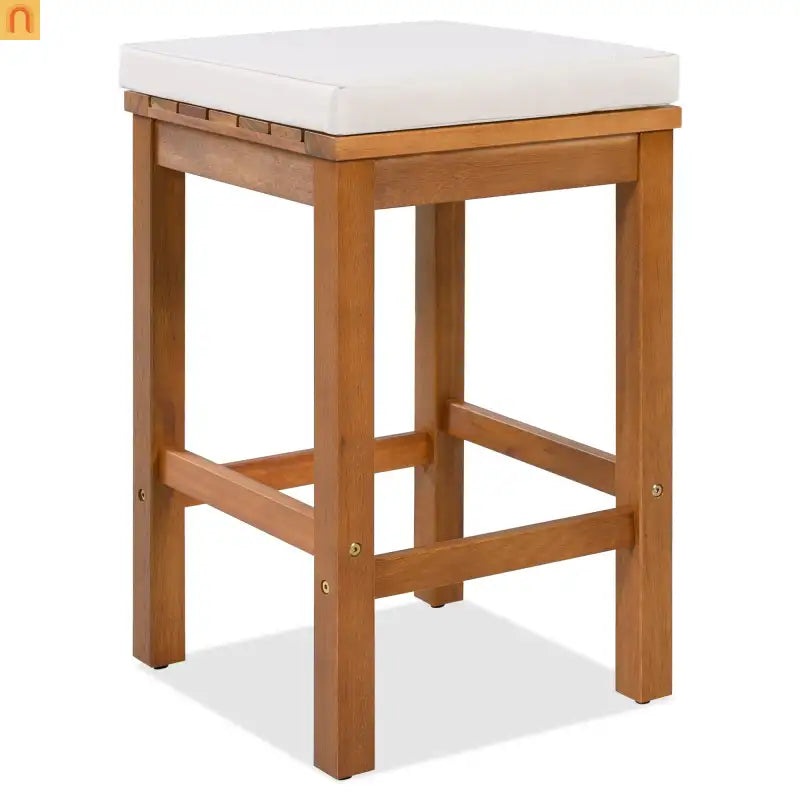 Wooden bar stool with a white cushion on a white background