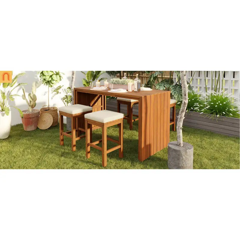 Outdoor wooden dining set with stools on a grassy area