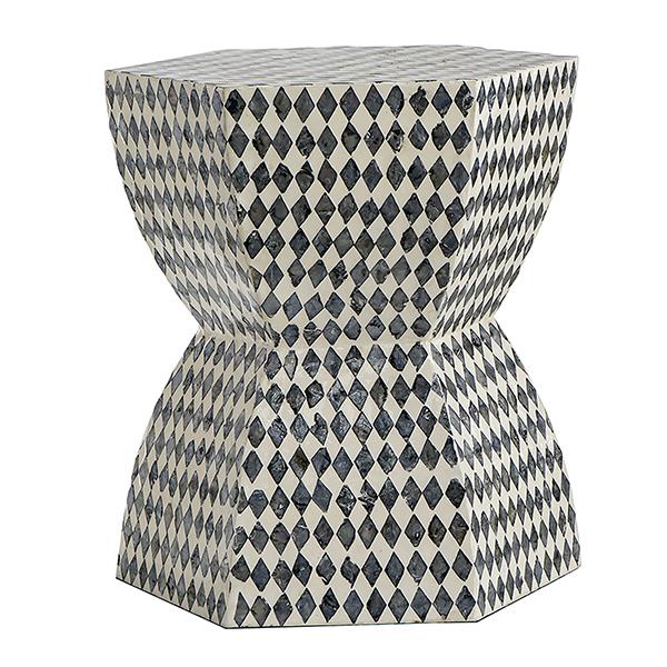 Hexagonal side table with black and white diamond pattern on a white background