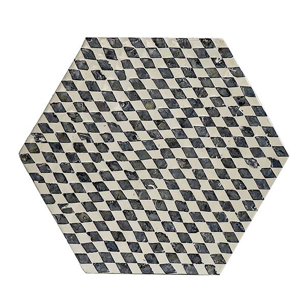 Hexagonal tile with black and white checkered pattern on a white background